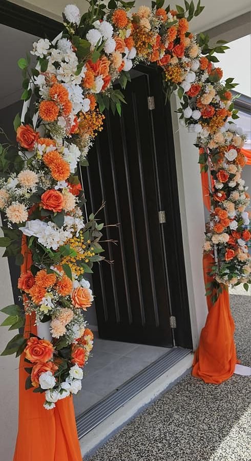 Wedding flower arch in orange theme