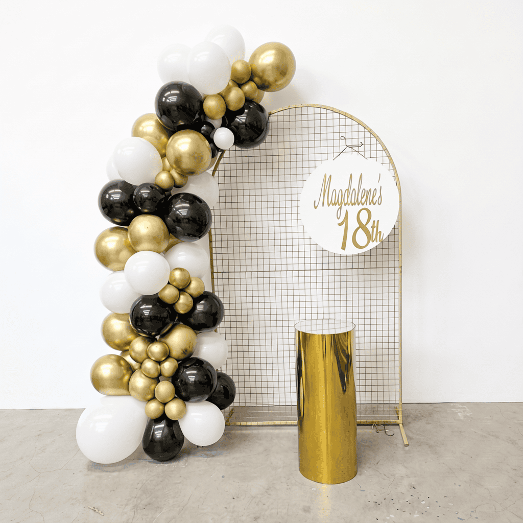 Balloon arch with black, white, and gold balloons for birthday event styling by JK DECO Melbourne.