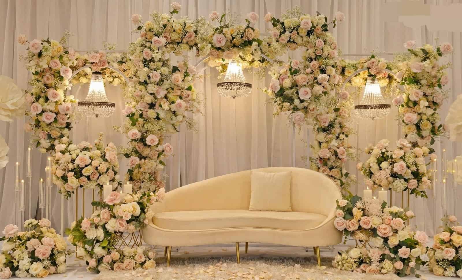 Beautiful wedding stage decorated with a floral arch and elegant lighting in Melbourne.