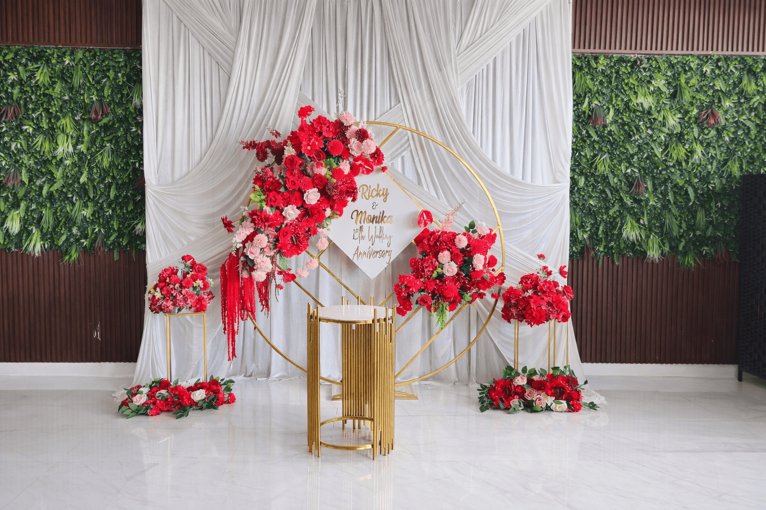 Engagement decoration with pink and red flowers, gold accents, perfect for Melbourne weddings.